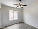 This spacious bedroom features a ceiling fan, a window that lets in natural light, and laminate floors at 2250 E Deer Valley Rd # 24, Phoenix, AZ 85024