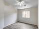 This spacious bedroom features a ceiling fan, a window that lets in natural light, and laminate floors at 2250 E Deer Valley Rd # 24, Phoenix, AZ 85024
