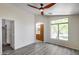 This spacious bedroom features a ceiling fan, a window that lets in natural light, and laminate floors at 2250 E Deer Valley Rd # 24, Phoenix, AZ 85024
