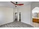 This spacious bedroom features a ceiling fan, and laminate floors with two entryways at 2250 E Deer Valley Rd # 24, Phoenix, AZ 85024