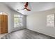 This spacious bedroom features a ceiling fan, two windows that let in natural light, and laminate floors at 2250 E Deer Valley Rd # 24, Phoenix, AZ 85024