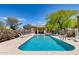 Beautiful community pool featuring a variety of lounge chairs, shaded area, and lush landscaping at 2250 E Deer Valley Rd # 24, Phoenix, AZ 85024