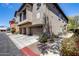 Exterior view of a multi-story residential building with garages, balconies, and landscaped surroundings in a well-maintained community at 2250 E Deer Valley Rd # 24, Phoenix, AZ 85024
