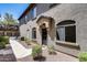 Exterior view of a lovely townhome with a walkway and attractive desert landscaping at 2250 E Deer Valley Rd # 24, Phoenix, AZ 85024