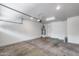 Spacious garage with epoxy floors, water heater, and door to the exterior at 2250 E Deer Valley Rd # 24, Phoenix, AZ 85024
