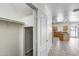 Hallway leading to a kitchen, featuring tile flooring and a stairwell at 2250 E Deer Valley Rd # 24, Phoenix, AZ 85024