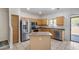 Kitchen with stainless steel appliances, center island, and tiled floors at 2250 E Deer Valley Rd # 24, Phoenix, AZ 85024
