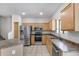 Kitchen with stainless steel appliances, light wood cabinets, and tile floors at 2250 E Deer Valley Rd # 24, Phoenix, AZ 85024