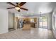 Spacious kitchen with stainless steel appliances, island, and sliding glass door to patio at 2250 E Deer Valley Rd # 24, Phoenix, AZ 85024