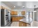 Kitchen with stainless steel appliances, island, and a window with outdoor view at 2250 E Deer Valley Rd # 24, Phoenix, AZ 85024