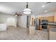 Open kitchen with stainless steel appliances, island, and access to the upper level at 2250 E Deer Valley Rd # 24, Phoenix, AZ 85024