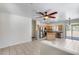 Open concept living space with tile floors, neutral paint, and kitchen with stainless appliances at 2250 E Deer Valley Rd # 24, Phoenix, AZ 85024