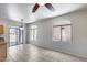 Bright living room with tile flooring, ceiling fan, and sliding glass door to patio at 2250 E Deer Valley Rd # 24, Phoenix, AZ 85024