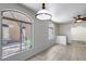 Bright living room featuring arch windows and decorative ceiling fan at 2250 E Deer Valley Rd # 24, Phoenix, AZ 85024