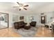 Comfortable living room with wood floors, cozy furniture, and easy kitchen access at 2259 E Ivy St, Mesa, AZ 85213