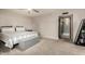 Comfortable bedroom featuring carpeted floors, large windows and an ensuite bathroom access at 2259 E Ivy St, Mesa, AZ 85213