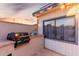 Outdoor kitchen with built-in BBQ grill and string lights at dusk at 2259 E Ivy St, Mesa, AZ 85213