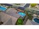 Private backyard oasis with pool, spa, lush landscaping, fire pit, and covered seating at 25943 N 84Th Dr, Peoria, AZ 85383