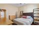 Comfortable bedroom featuring neutral tones, a stylish headboard, and shelving at 25943 N 84Th Dr, Peoria, AZ 85383
