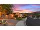 Charming single-story home featuring a well-maintained lawn, desert landscaping, and two car garage at 25943 N 84Th Dr, Peoria, AZ 85383