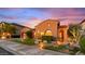Charming single-story home featuring a well-maintained lawn, desert landscaping, and two car garage at 25943 N 84Th Dr, Peoria, AZ 85383