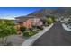 Charming single-story home featuring a well-maintained lawn, desert landscaping, and two car garage at 25943 N 84Th Dr, Peoria, AZ 85383