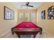 Bright game room with a stylish pool table, perfect for entertaining friends and Gathering at 25943 N 84Th Dr, Peoria, AZ 85383