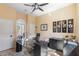 Bright home office featuring a modern desk, natural light, and neutral decor creating a productive workspace at 25943 N 84Th Dr, Peoria, AZ 85383