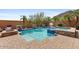 Gorgeous in-ground pool and spa with brick surround, mature trees, and desert landscaping at 25943 N 84Th Dr, Peoria, AZ 85383