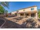 Spacious backyard with a covered patio, potential for landscaping, and privacy fence at 3133 N Medallion Ct, Casa Grande, AZ 85122