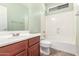 Bathroom featuring a sink, toilet and bathtub and shower combination at 3133 N Medallion Ct, Casa Grande, AZ 85122