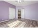 Bedroom with painted walls, wood-look floors, closet and entry door at 3133 N Medallion Ct, Casa Grande, AZ 85122