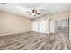 Large bedroom boasting wood-look flooring, ceiling fan, and closet space at 3133 N Medallion Ct, Casa Grande, AZ 85122