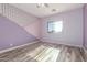 Bedroom with painted walls, a window, and wood-look floors at 3133 N Medallion Ct, Casa Grande, AZ 85122