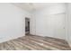 This bedroom has wood-look floors and a closet for storage at 3133 N Medallion Ct, Casa Grande, AZ 85122