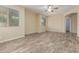 Bright bedroom with wood floors, a ceiling fan, large windows, and a neutral color scheme at 3133 N Medallion Ct, Casa Grande, AZ 85122