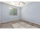 Bedroom featuring neutral walls, wood-look floors, and a window at 3133 N Medallion Ct, Casa Grande, AZ 85122
