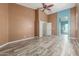 Bright bedroom with wood-look floors connecting to an en-suite bathroom with turquoise accents at 3133 N Medallion Ct, Casa Grande, AZ 85122
