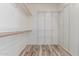 Walk-in closet with wood-look flooring and adjustable wire shelving for optimal storage at 3133 N Medallion Ct, Casa Grande, AZ 85122