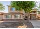 Charming two-story home featuring stucco siding, shutters, and a well-maintained front yard at 3133 N Medallion Ct, Casa Grande, AZ 85122