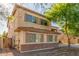 Charming two-story home featuring stucco siding, shutters, and a well-maintained front yard at 3133 N Medallion Ct, Casa Grande, AZ 85122