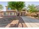 Charming two-story home featuring stucco siding, shutters, and a well-maintained front yard at 3133 N Medallion Ct, Casa Grande, AZ 85122