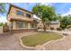 Lovely two-story home featuring stucco exterior, shuttered windows, and desert landscaping at 3133 N Medallion Ct, Casa Grande, AZ 85122