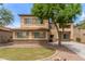 Charming two-story home with desert landscaping, brick accents, and light tan stucco at 3133 N Medallion Ct, Casa Grande, AZ 85122