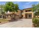 Inviting two-story home showcasing neutral stucco, brick accents, and a well-maintained lawn at 3133 N Medallion Ct, Casa Grande, AZ 85122