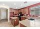 Spacious kitchen features tile flooring, stainless steel appliances, and dark wood cabinets at 3133 N Medallion Ct, Casa Grande, AZ 85122