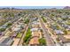 An aerial view of a street and neighborhood with well-maintained homes, many with private pools in the backyards at 355 E Fillmore St, Tempe, AZ 85288