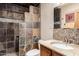 Stylish bathroom with stone-tiled shower, modern vanity, and mosaic accents at 355 E Fillmore St, Tempe, AZ 85288