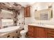 Elegant bathroom featuring a soaking tub, tiled shower, and stylish vanity with updated fixtures at 355 E Fillmore St, Tempe, AZ 85288