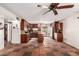 Spacious kitchen featuring ample wood cabinetry, a center island, and classic tile flooring at 355 E Fillmore St, Tempe, AZ 85288